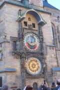 Astronomical Clock, chiming. Two dolls are looking out from windows above the clock